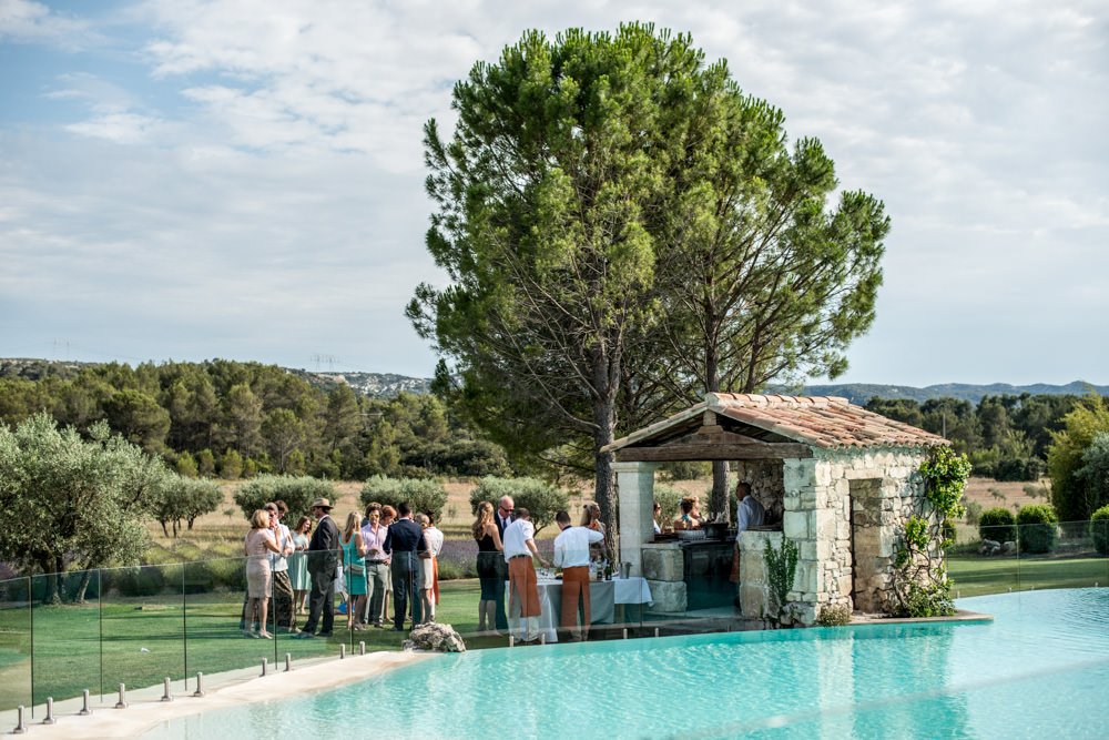 reception around pool at Le Mas de La Rose wedding venue