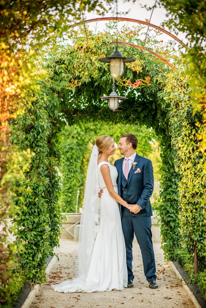 bride and groom in gardens at Le Mas de La Rose France