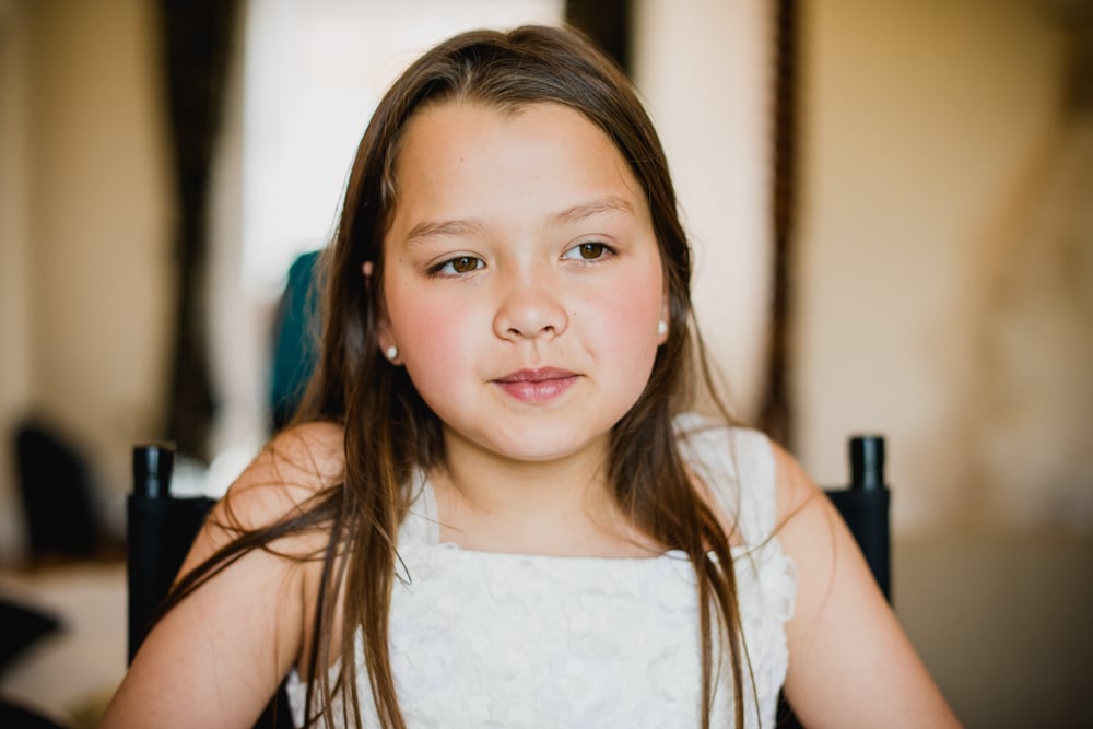 flower girl getting a little bit of make up