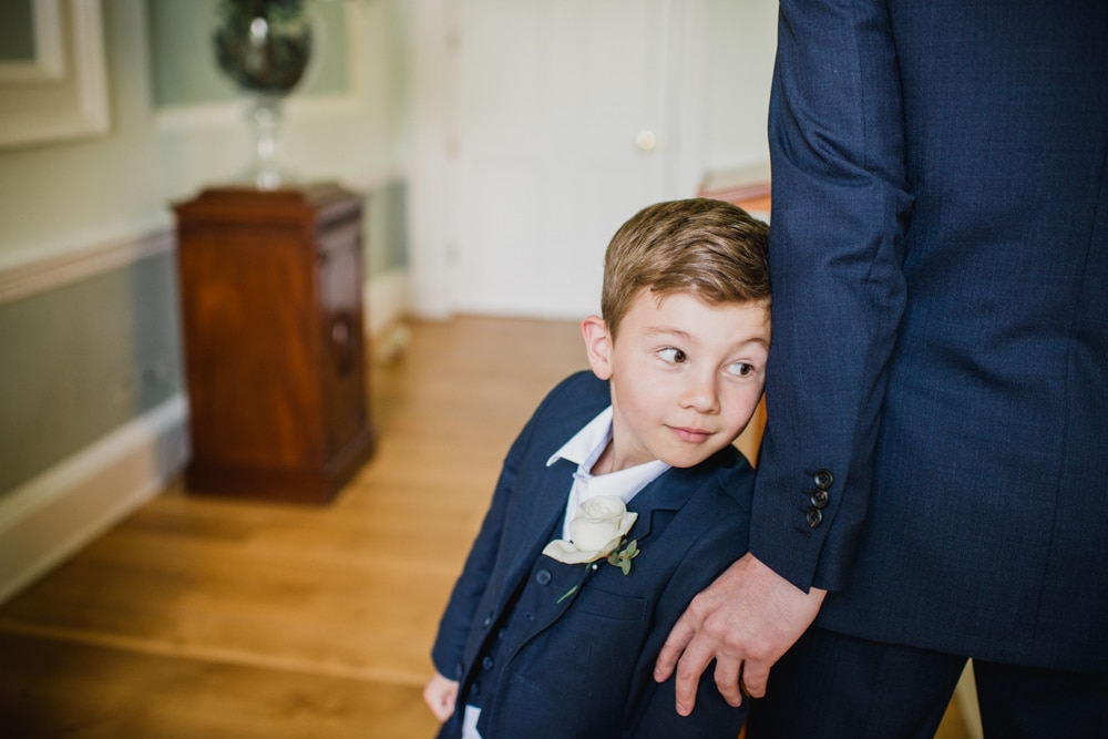 pageboy awaiting bride to walk down the aisle at Botleys