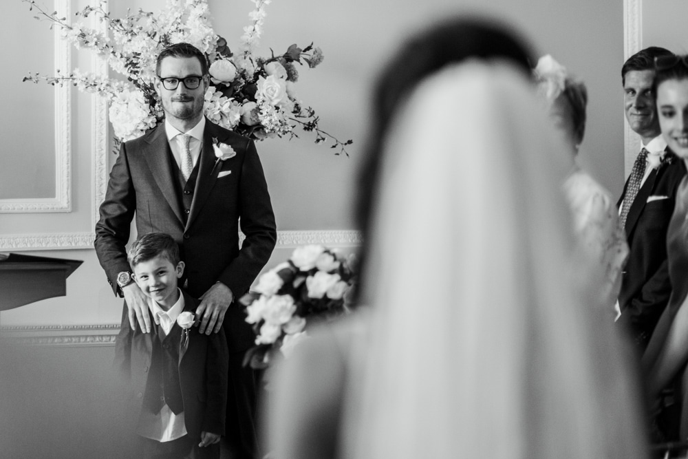 groom seeing his bride walking down the aisle at Botleys Mansion