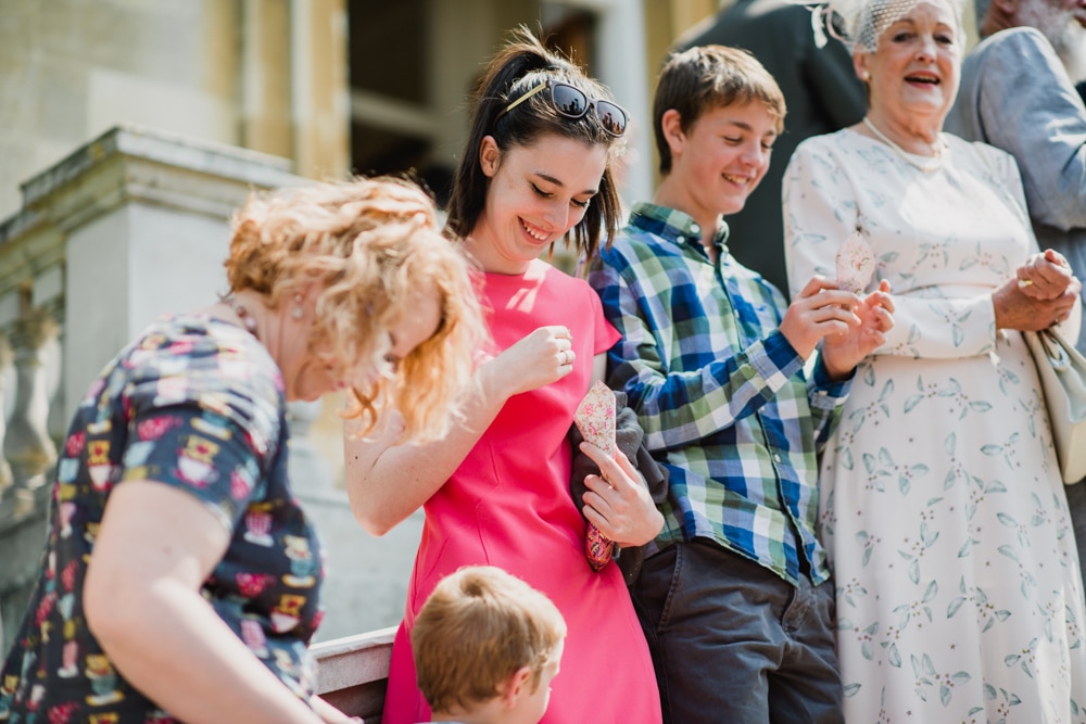 wedding guests with confetti