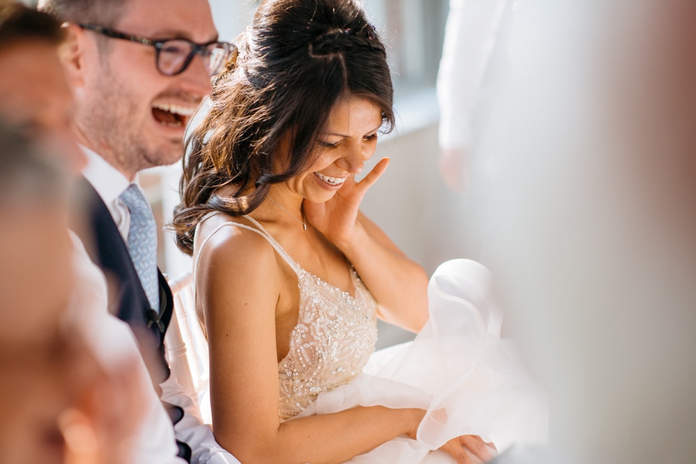 bride smiling during speeches