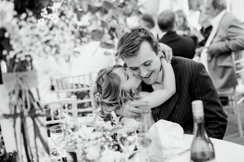 father and daughter hug during wedding breakfast