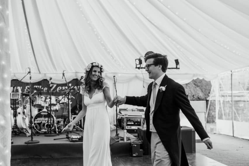 bride and groom make their entrance into Marquee