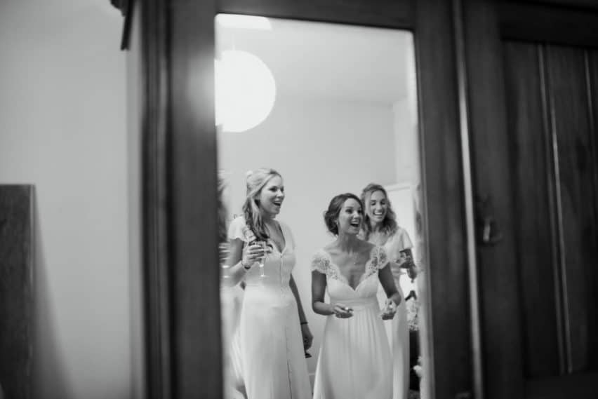 bride and bridesmaids in mirror