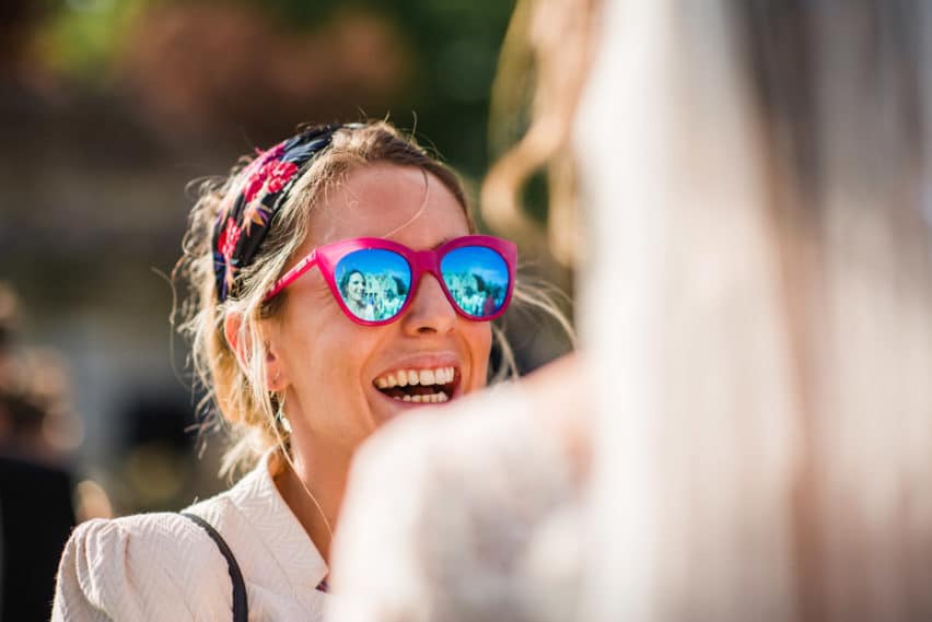 wedding guest wearing mirrored glasses