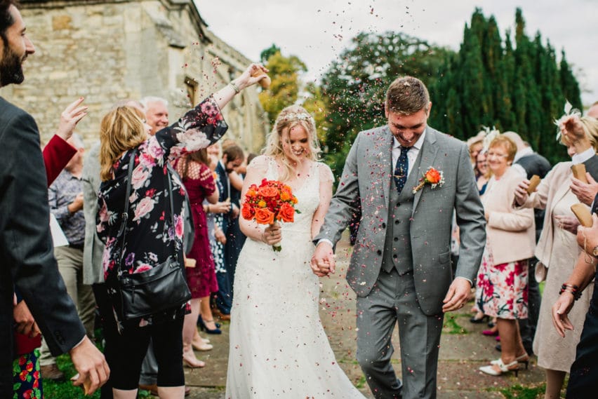 couple walking through confetti