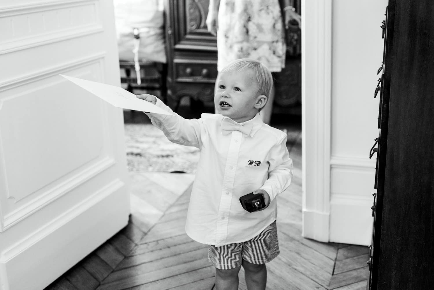 pageboy handing over gift to groom