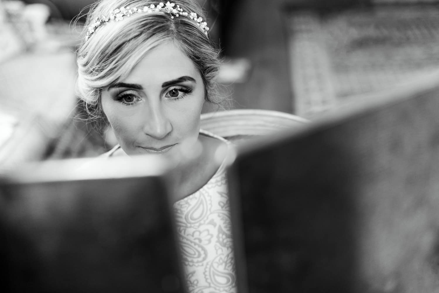 bride looking into mirror