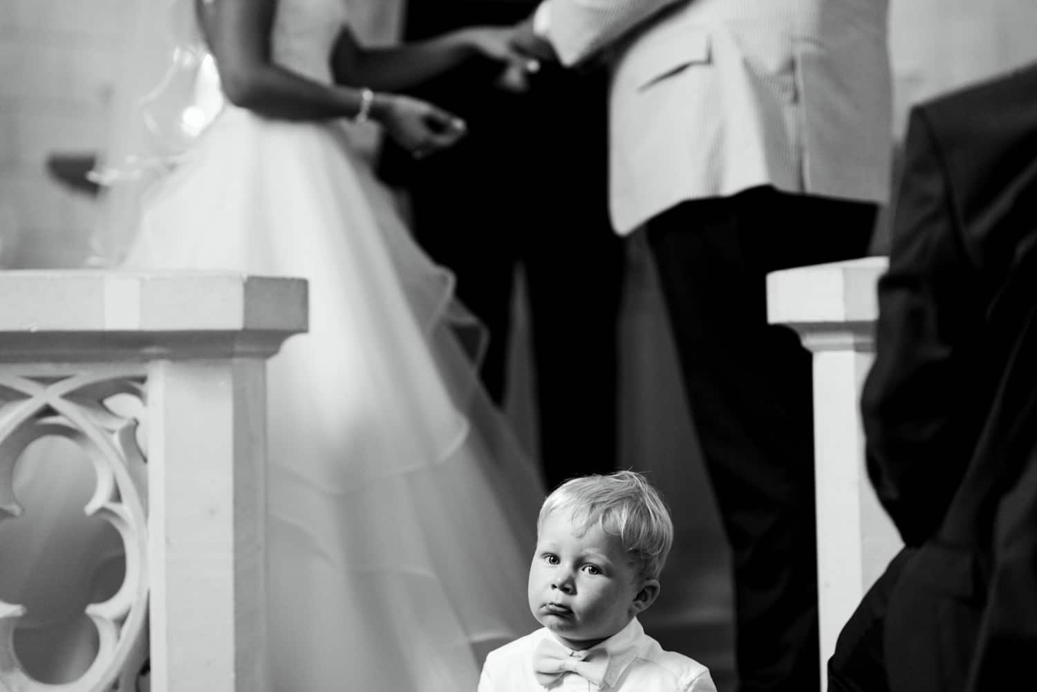 kid sitting on step in church