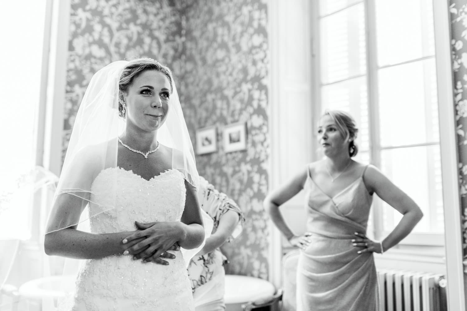 bride looking at herself in the mirror