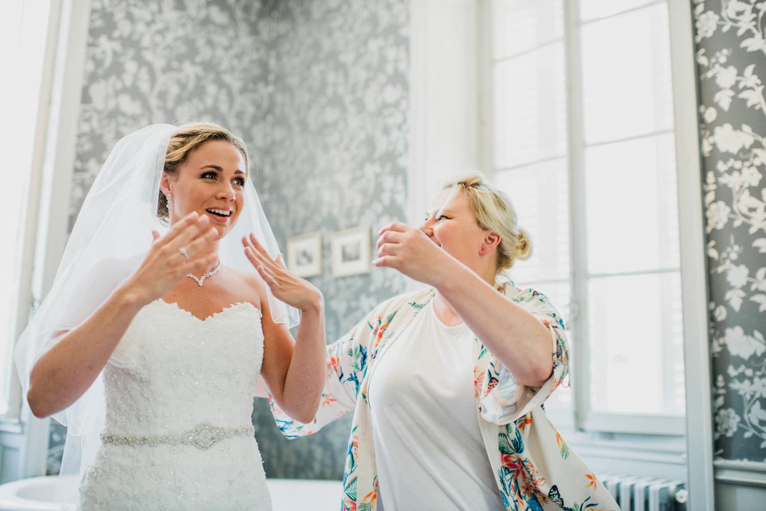 bride looking at herself in the mirror