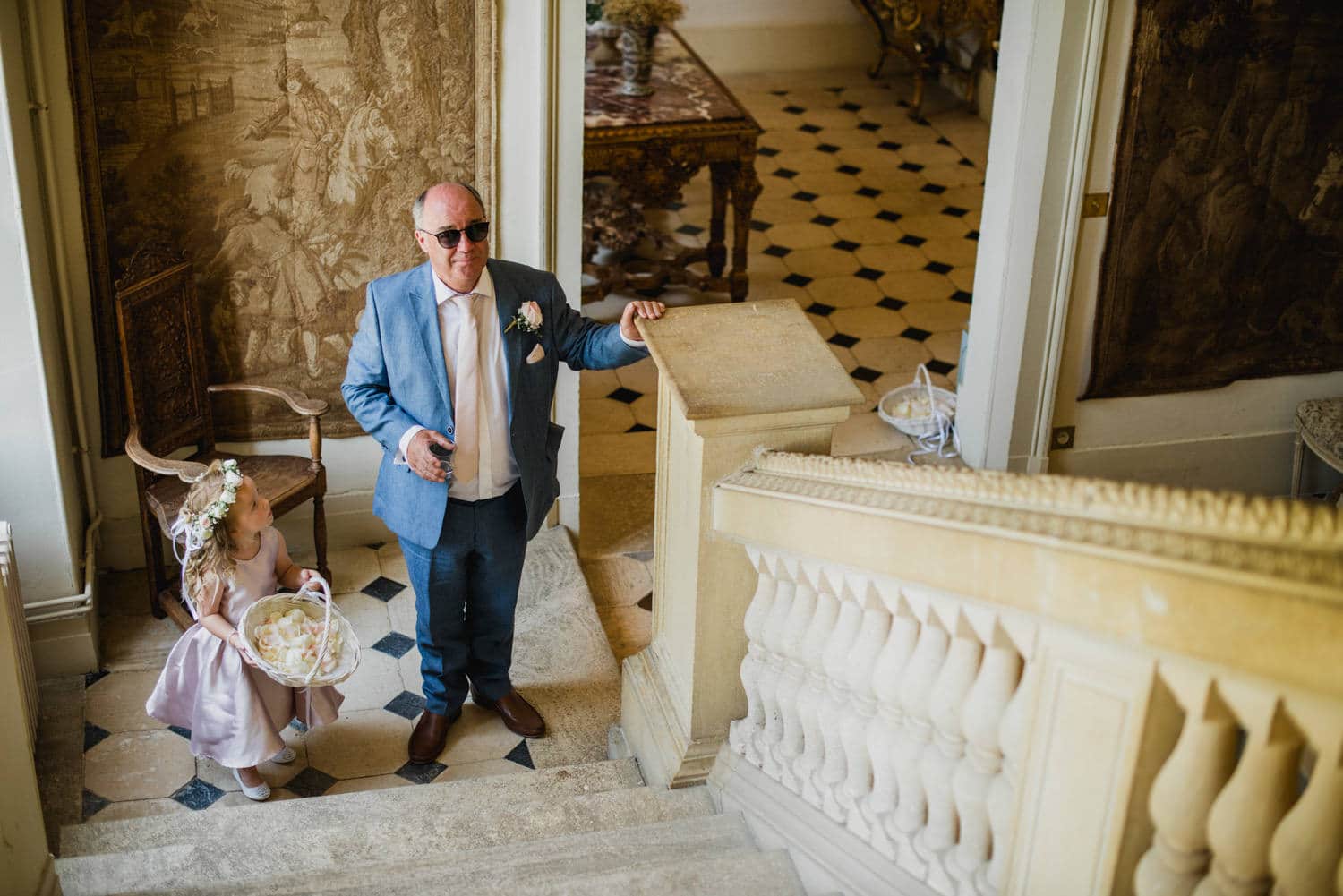 father of the bride waiting at the bottom of the stairs at Chateau la Durantie