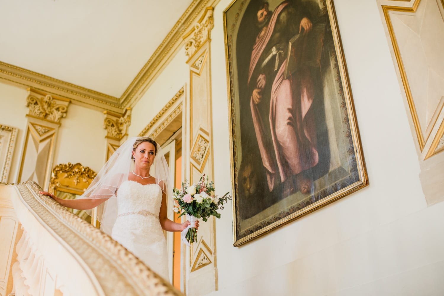 bride walking down the stairs at Chateau la Durantie