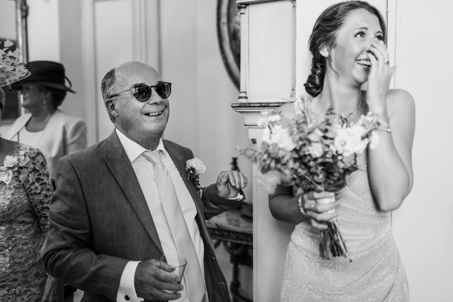 father of bride seeing daughter in dress