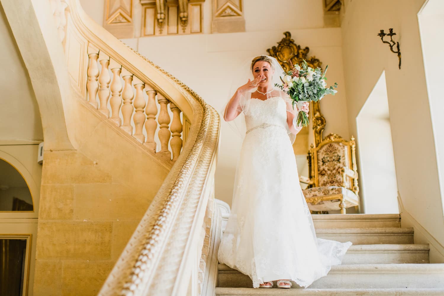 bride walking down the stairs at Chateau la Durantie