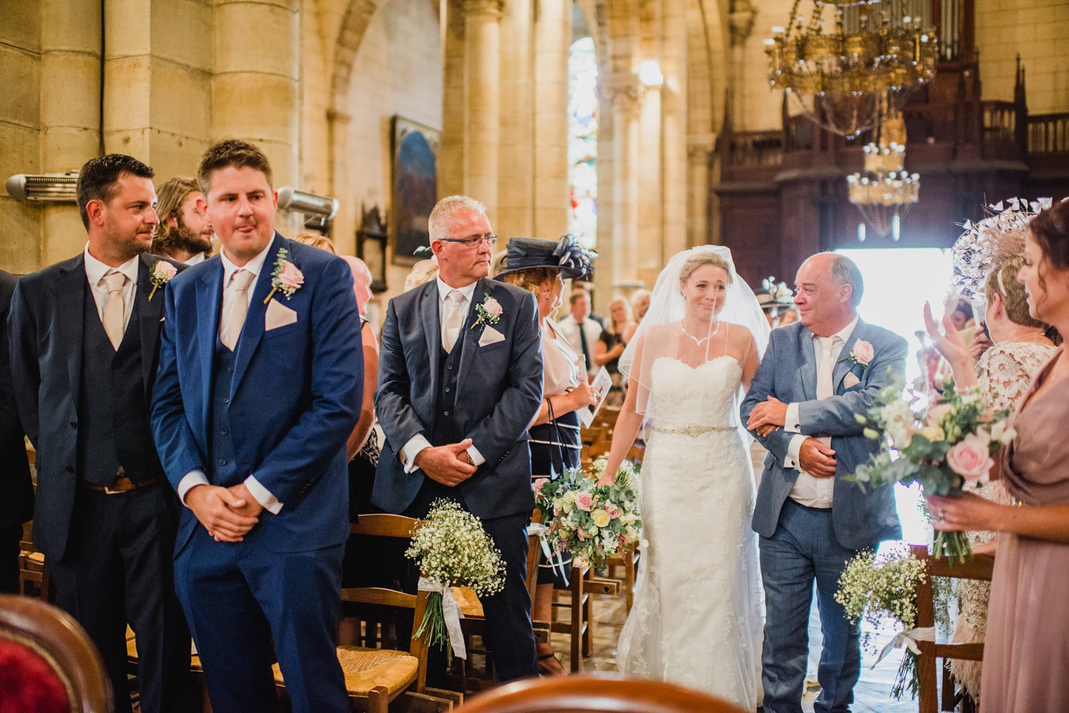 bride walking down the aisle at Excideuil Saint Thomas