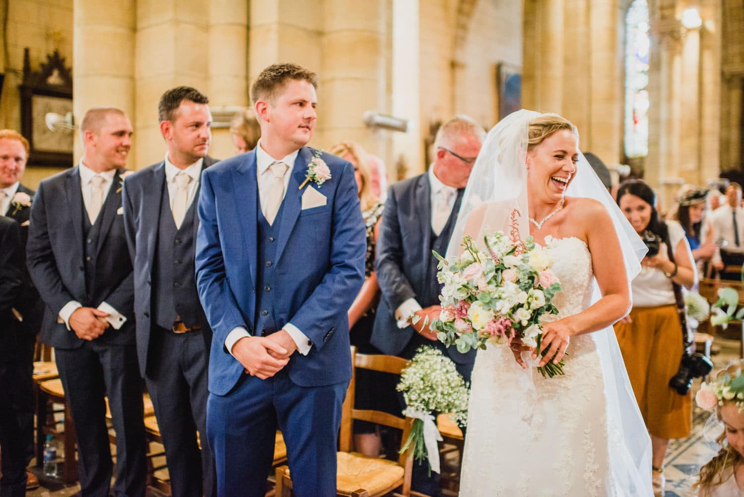 bride walking down the aisle at Excideuil Saint Thomas