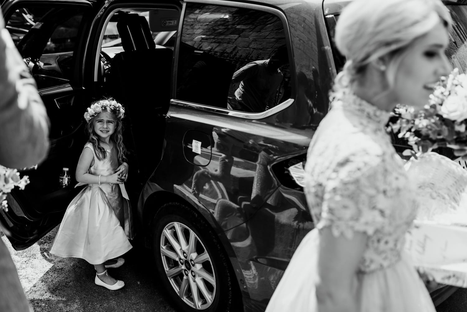 flower girl getting into car