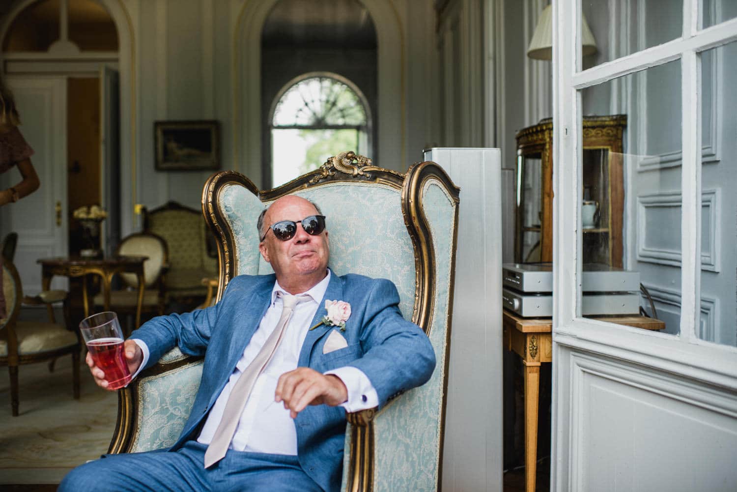 father of bride sitting on chair