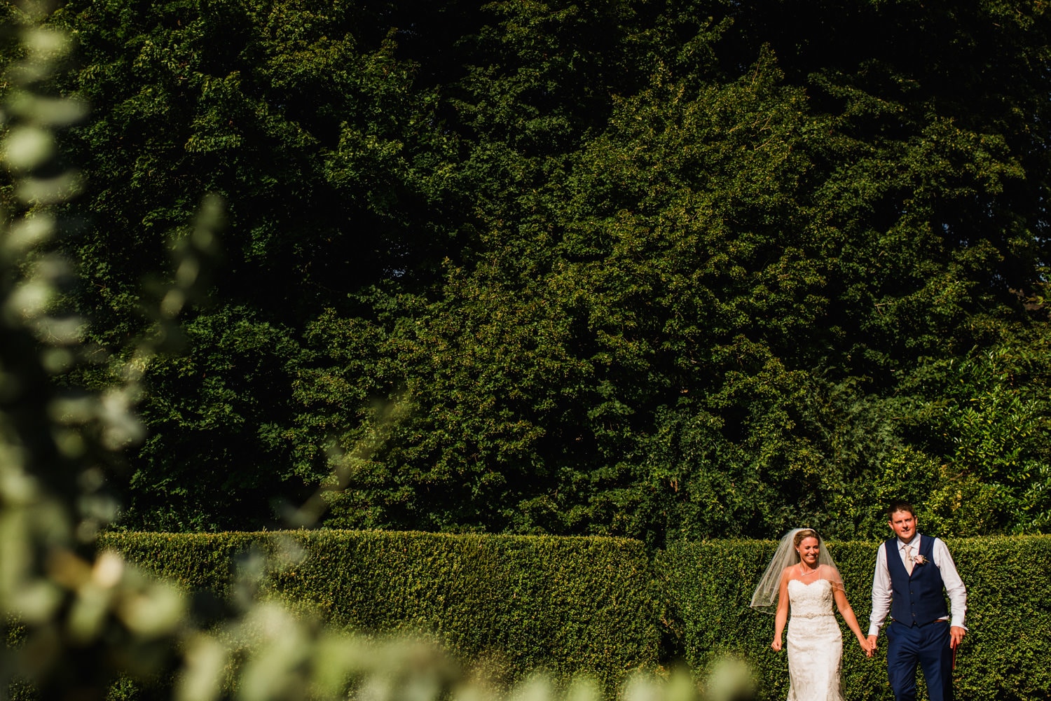 bride and groom walking to their table