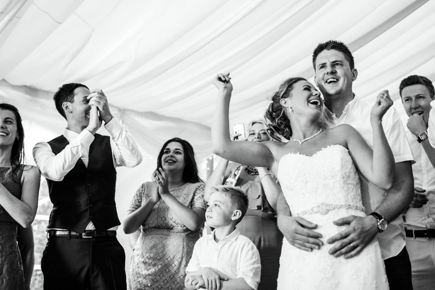 bride and groom enjoying performance