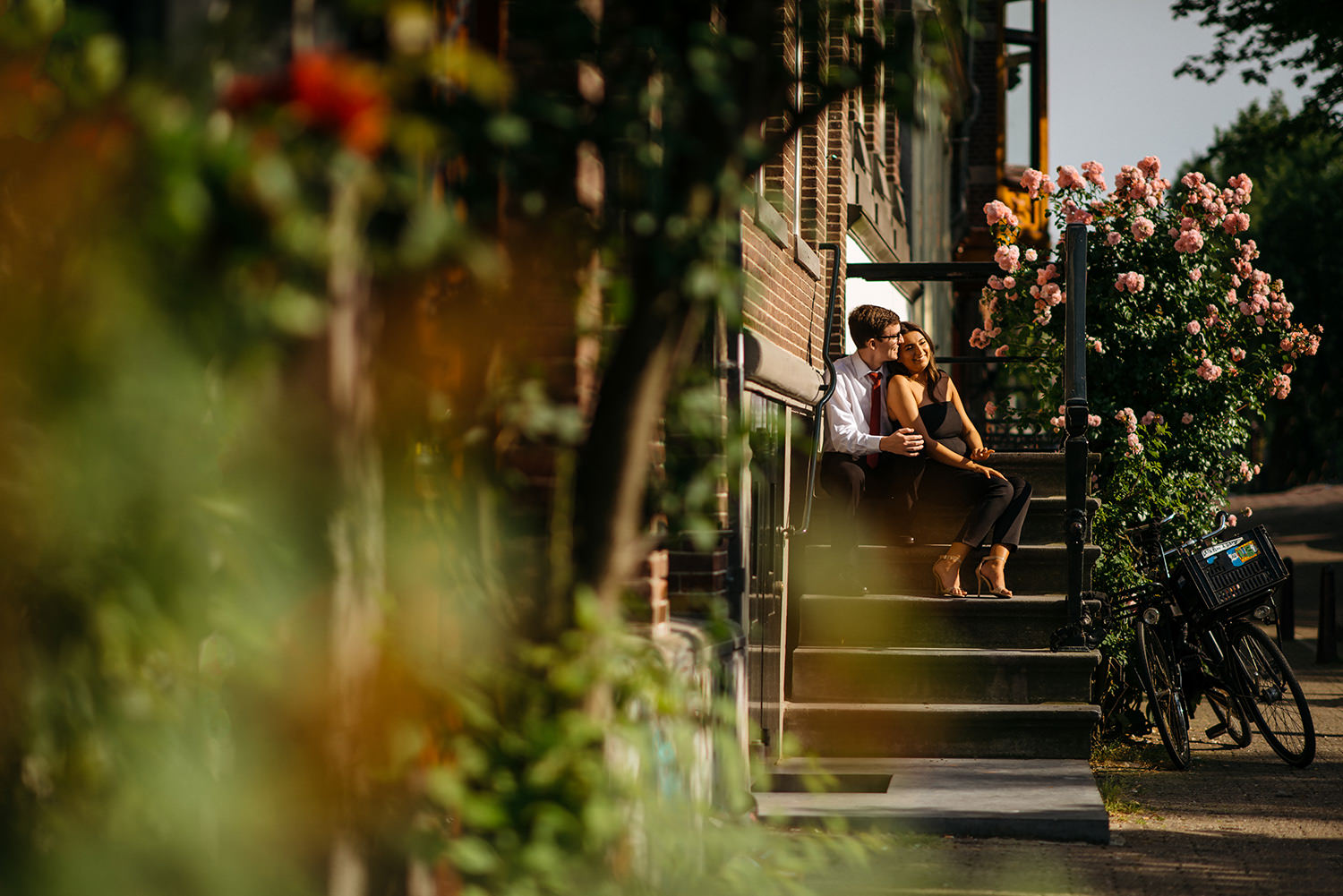 Amsterdam Engagement Photography couple sitting on steps